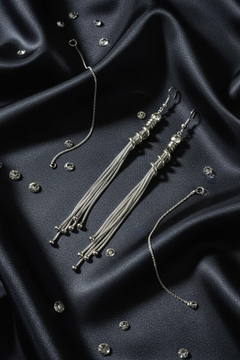 stunning Silver plated long tassel drop earrings for pierced ears featuring a top crystal accent, a metallic spiral coil, and cascading fine chains with bead tips. 