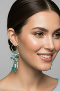 Turquoise beaded chandelier hoop earrings featuring cascading aqua and teal stone-shaped beads on delicate silver chains.
